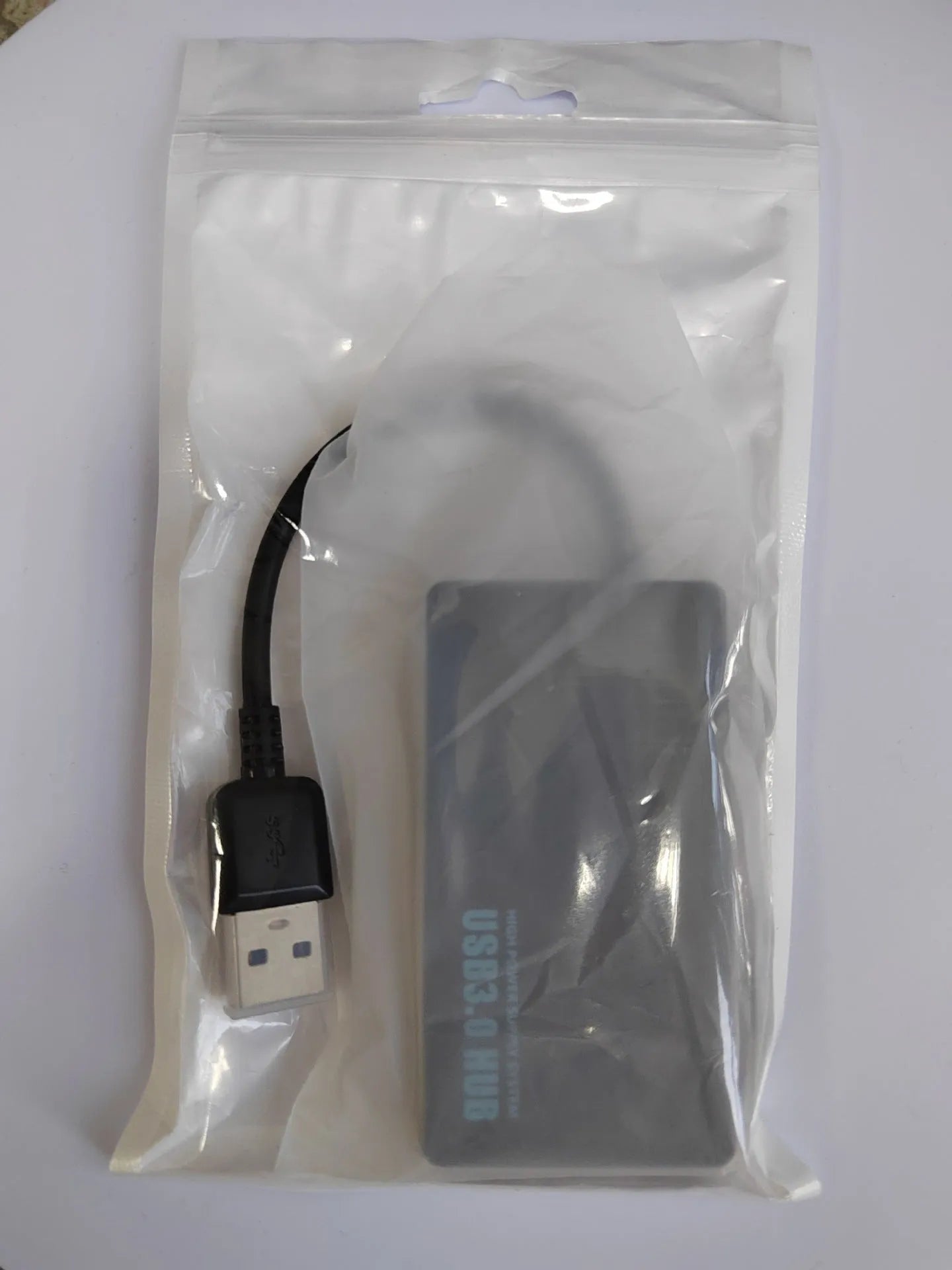 A white one-to-four-port USB hub with a 20cm cable, shown with USB-A and Type-C connector options.