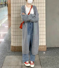 Women's loose fit knitted cardigan in khaki, showing V-neck and long sleeves.