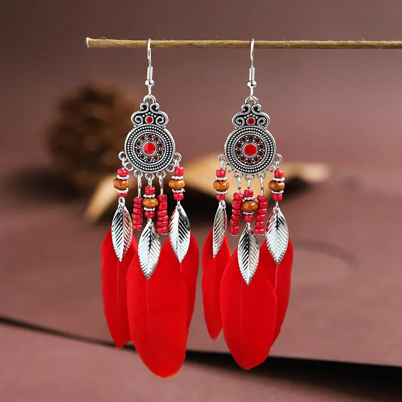 Handmade feather pattern bohemian earrings in multiple colours with leaf design detail