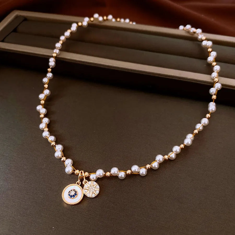 Gold electroplated zircon pearl round pendant necklace on clavicle chain with Chinese style design