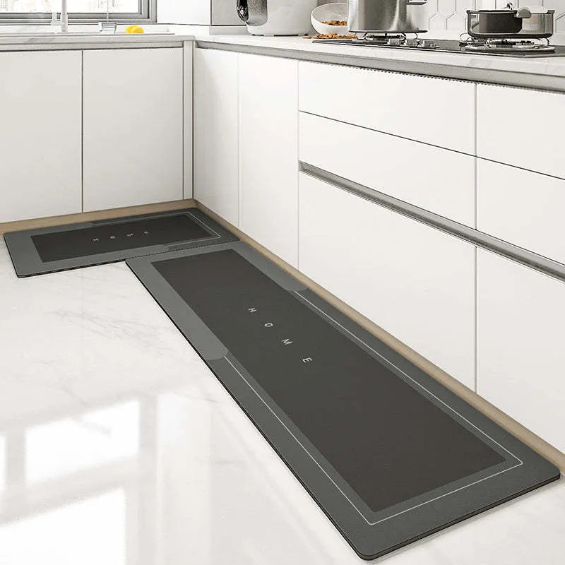 Machine-woven blended bathroom floor mat in blue, shown in an oval shape on a tiled floor.