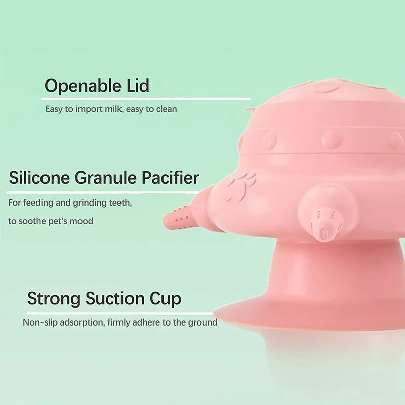 Pink silicone pet nursing device with pacifiers for feeding puppies and kittens.