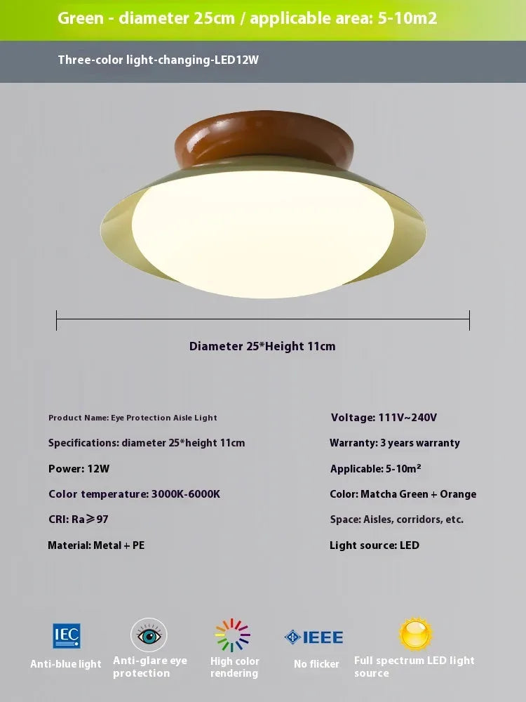 Modern cream style flying saucer shaped ceiling lamp in an iron shade.