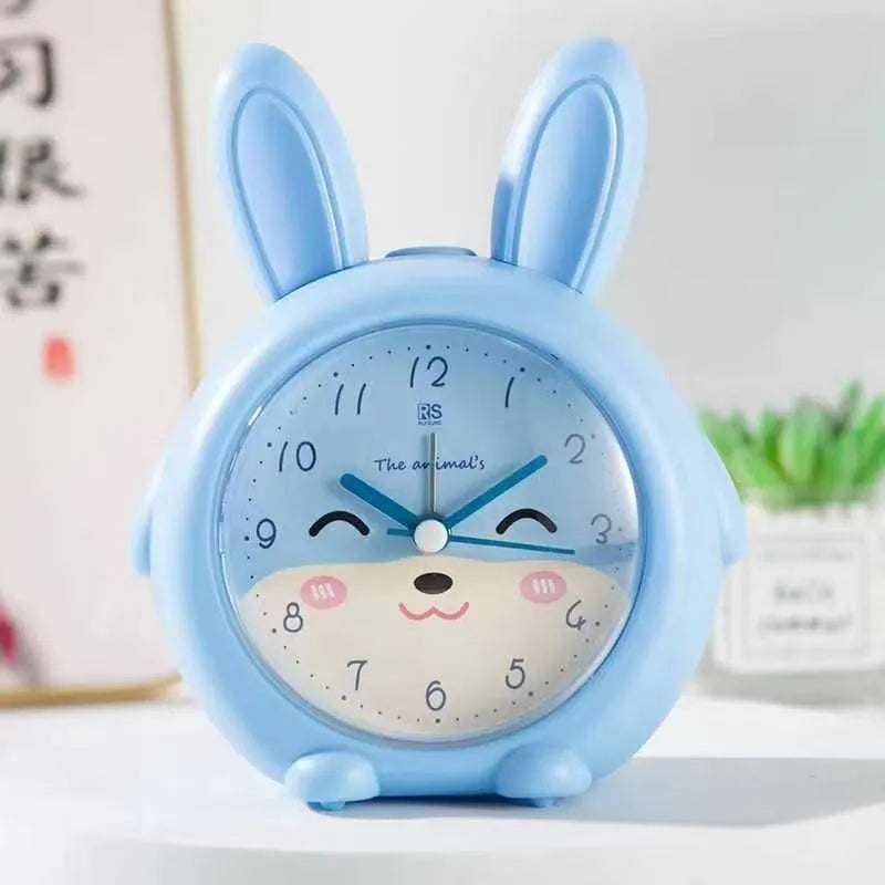 Children's cartoon alarm clock with singing alarm and night light in pink or blue ABS plastic