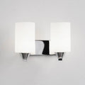 A modern chrome wall lamp with a clear glass shade, shown in single-head and double-head styles.