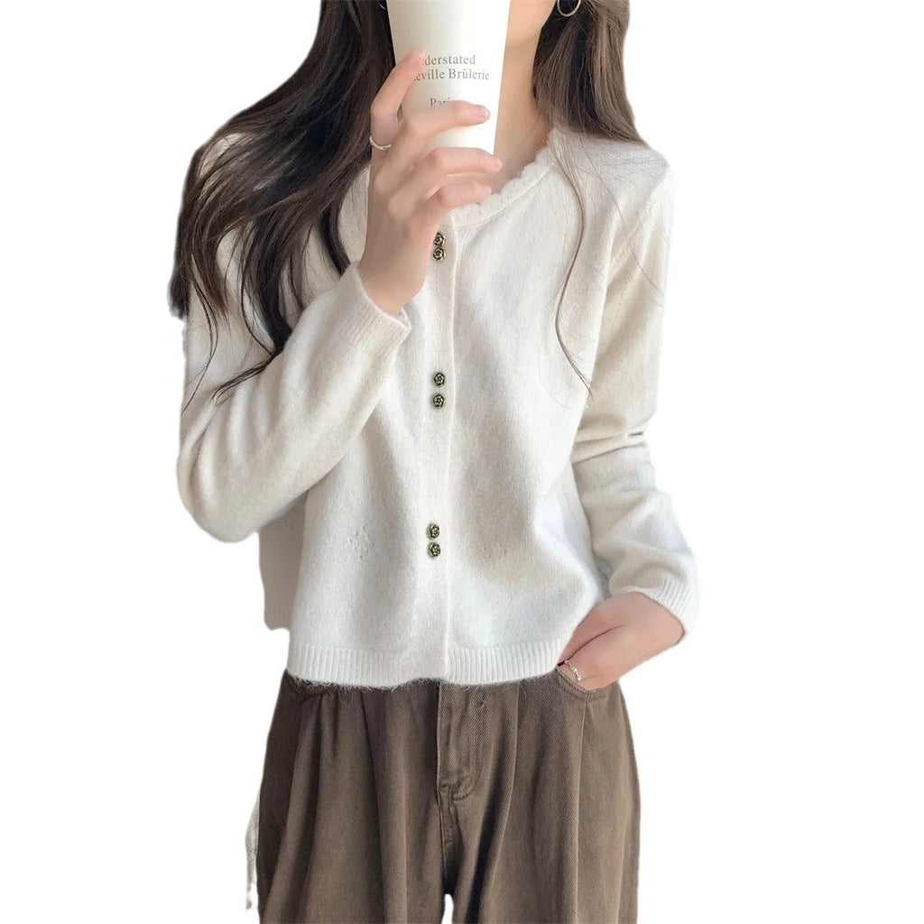 Women's long-sleeved acrylic fibre cardigan coat in milky white colour showing regular fit