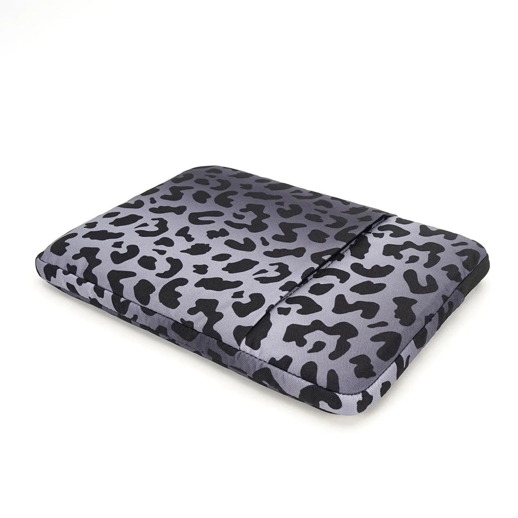 Leopard print laptop sleeve for 13-inch to 16-inch devices, showing anti-shock and waterproof features