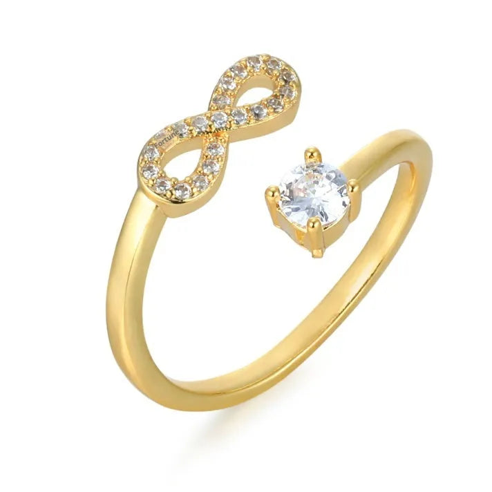 Open geometric ring with a letter charm inlaid with zircon stones, shown in silver finish.