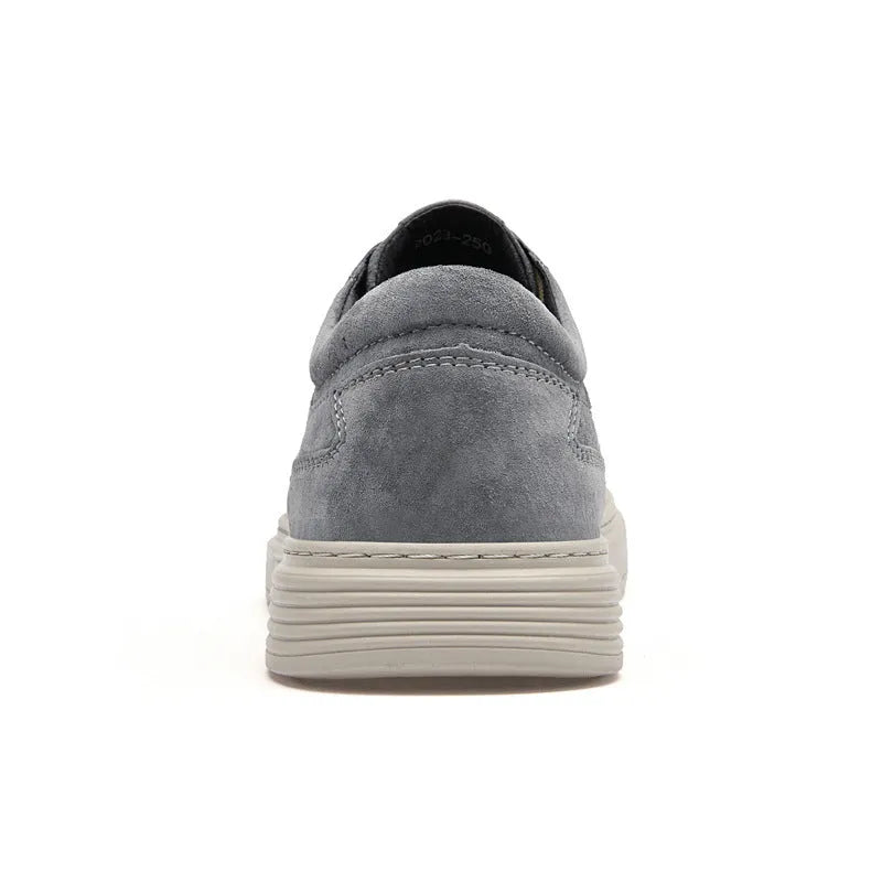 Men's grey casual leather skate shoes with low-top design and round toe on a rubber sole.