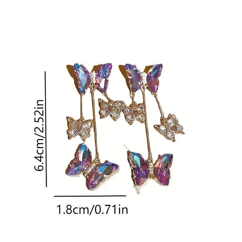 Silver Needle Crystal Flowers Blue Purple Butterfly Tassel Drop Earrings on a white background.