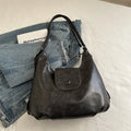 Women's PU leather shoulder bag with single strap, horizontal square design, and internal phone pouch in black colour