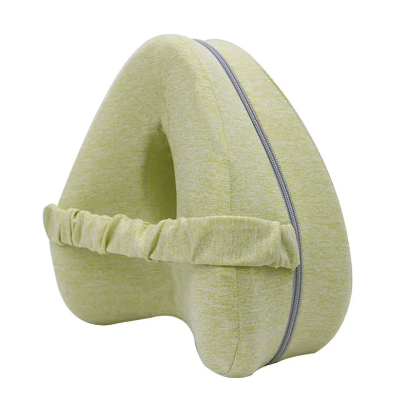 Heart-shaped dark blue memory foam leg pillow for adult use.