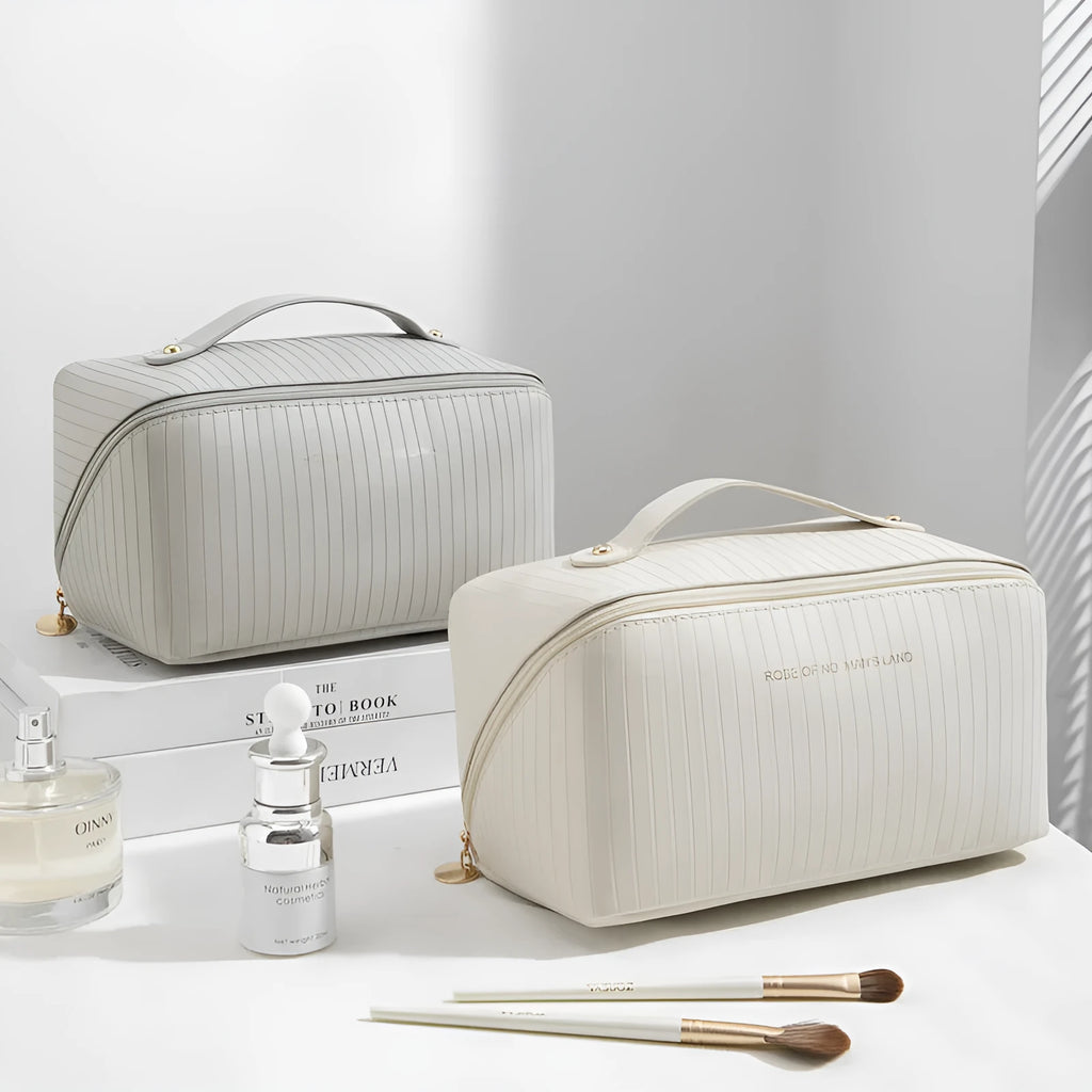 Vertical pattern pillow makeup bag in beige, black, brown, grey, or pink, showing cubic 22.5cm shape.