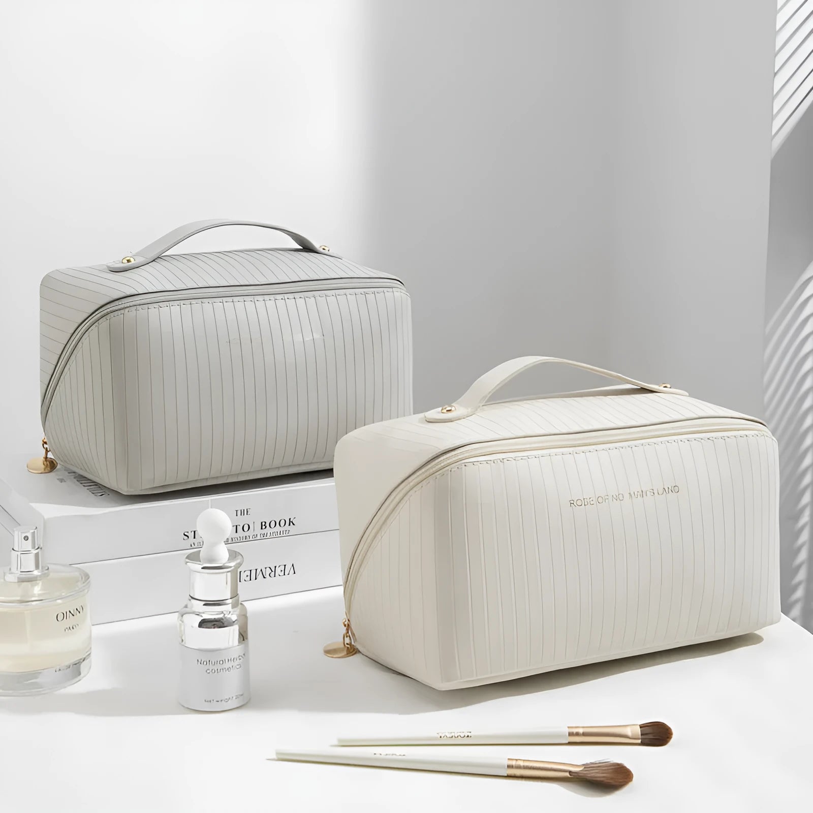Vertical pattern pillow makeup bag in beige, black, brown, grey, or pink, showing cubic 22.5cm shape.