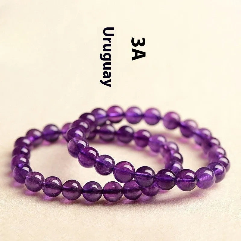 Natural amethyst Uruguay bracelet with polished purple beads, shown in single circle and triple ring designs.