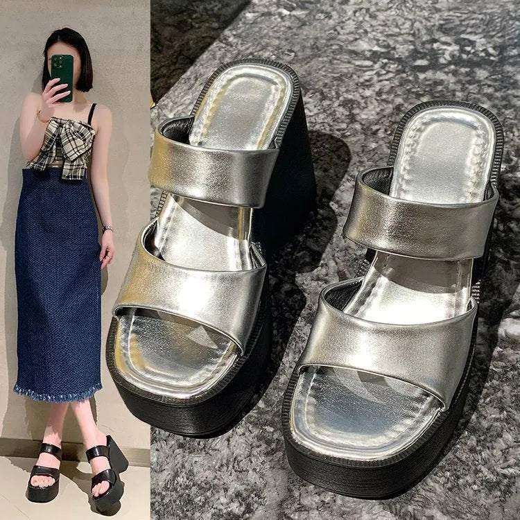 Women's black wedge platform slippers with a square toe and PU upper material.