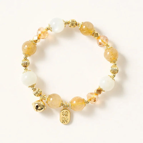 Gold electroplated bracelet featuring natural rutilated quartz crystals with golden rutile needle inclusions
