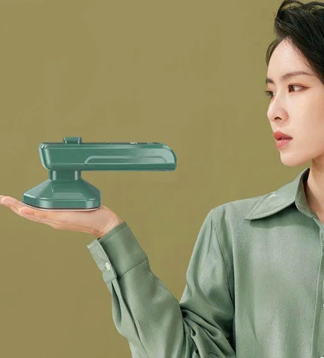 Dark green portable hanging steam ironing machine with ceramic panel and compact design.