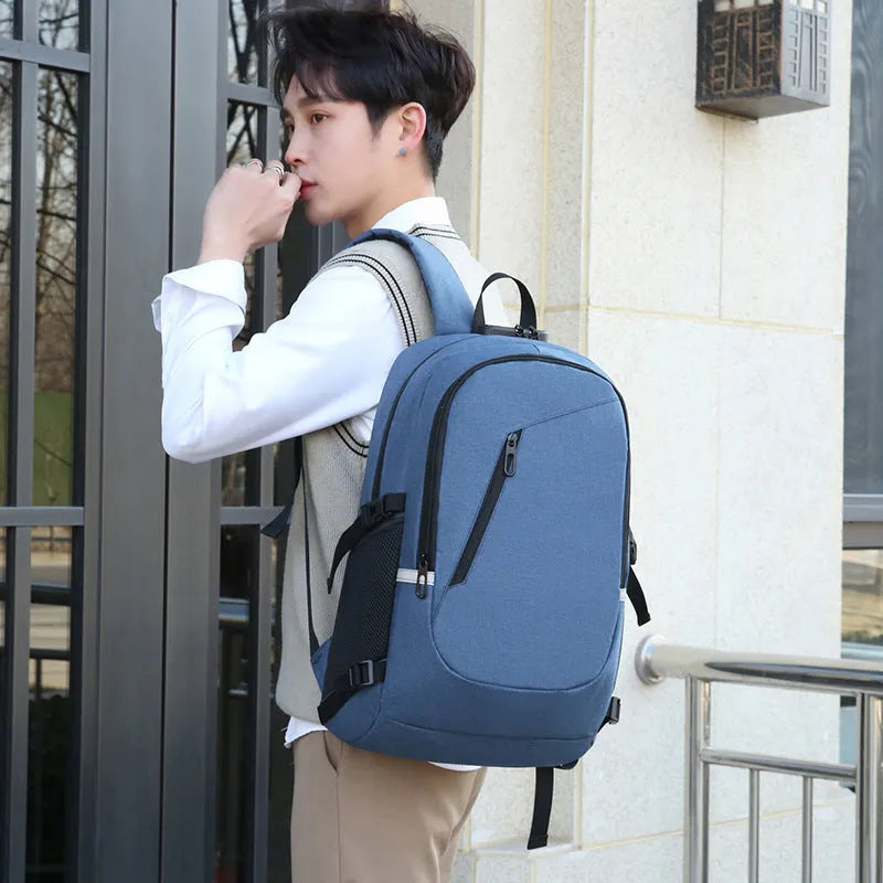 Blue unisex Oxford cloth computer backpack with a street style design, shown from the side.