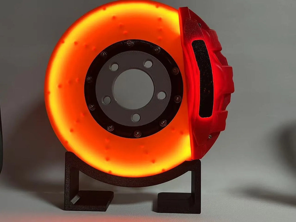 Brake disc themed LED desktop night light in blue caliper colour with touch control
