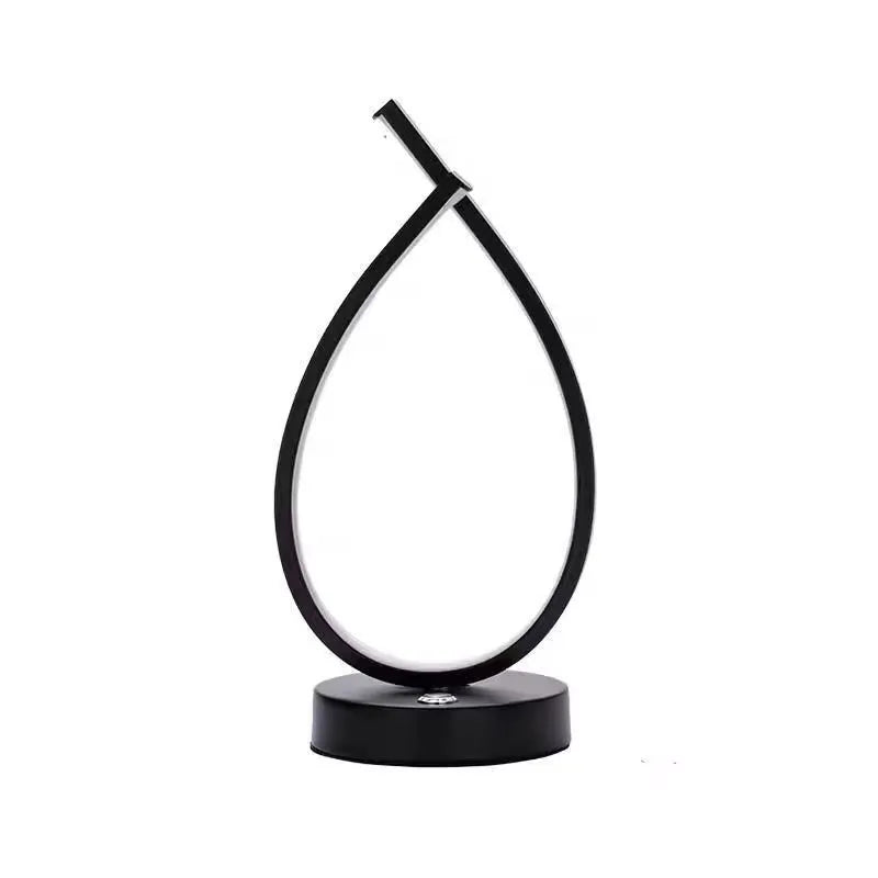 Creative water drop shaped desk lamp in black or white with warm LED lighting