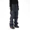 Man wearing dark blue loose fit straight leg denim jeans.