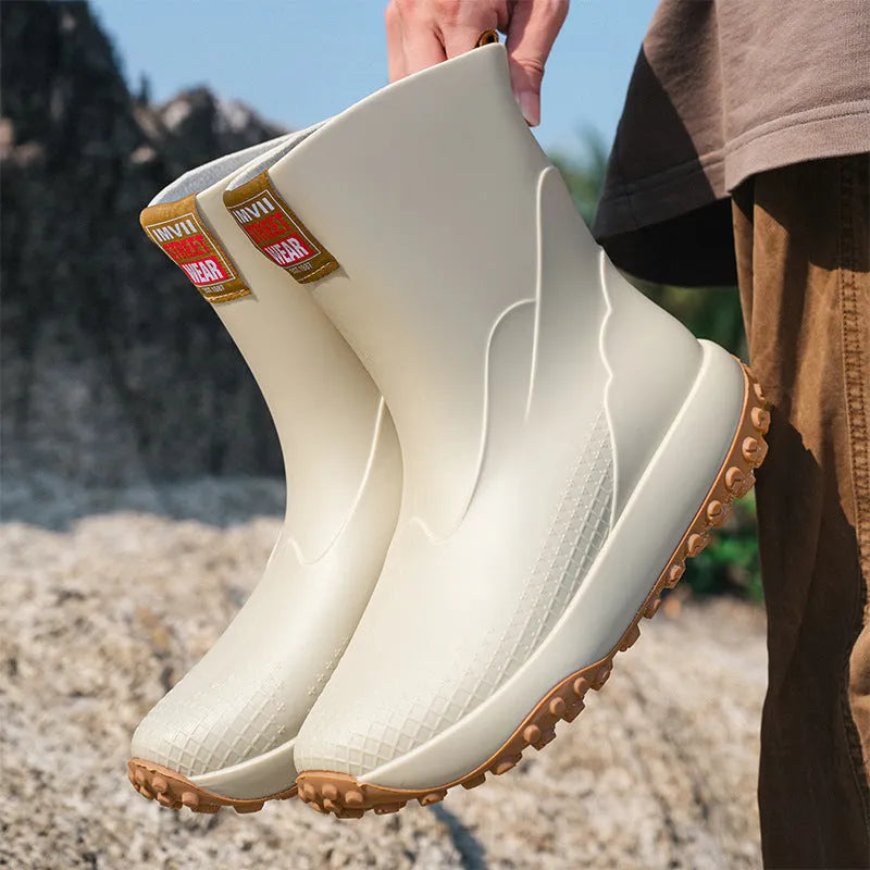 Men's mid-height PVC rain boot in beige colour with a round toe and plastic sole.