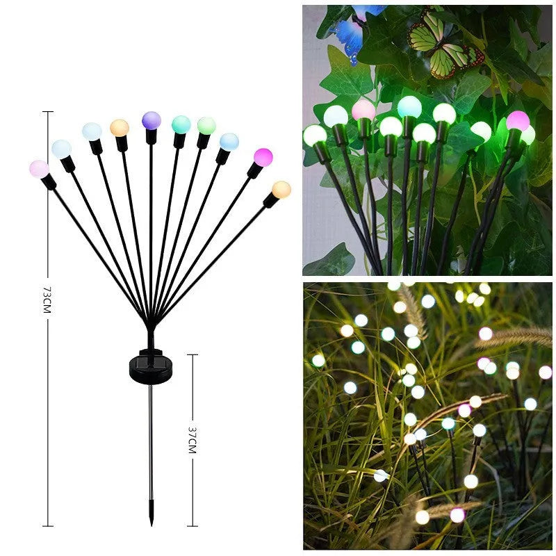 Solar-powered LED firefly garden spike light with multiple heads and a press-in ground plug on grass.