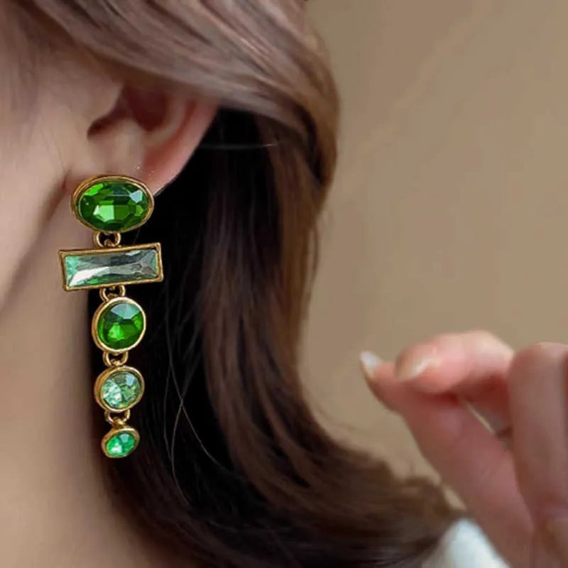 Green gradient tassel dangle earrings with geometric metal frame and sparkling zircon stones.