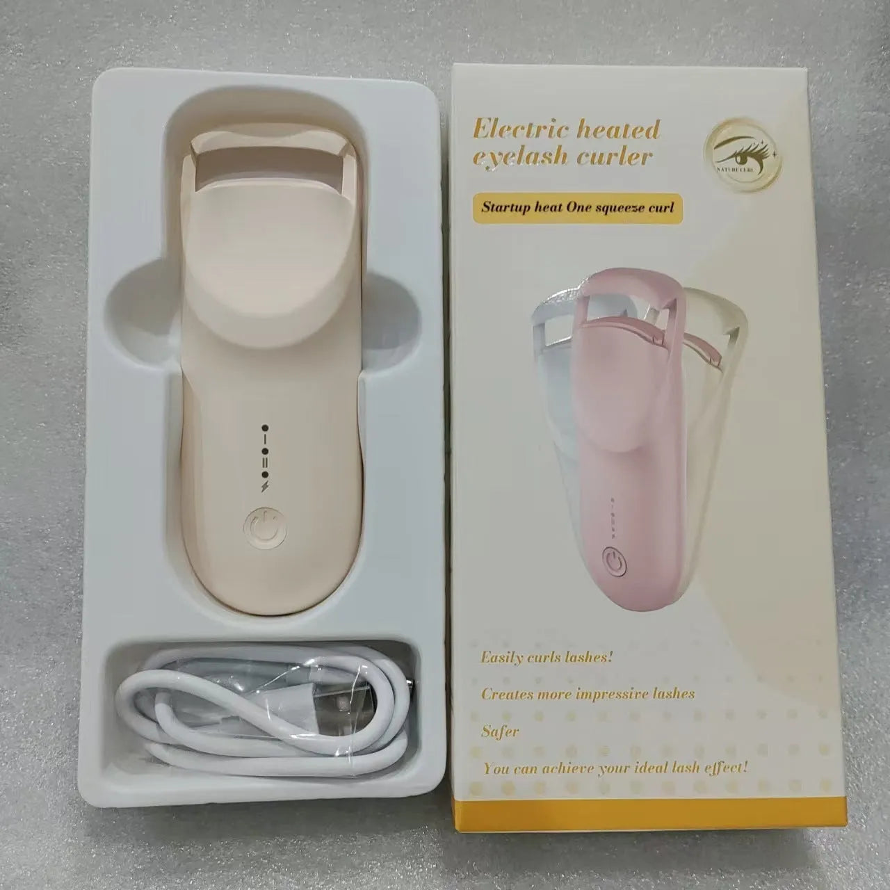 Electric USB-rechargeable eyelash curler in cream white, pink, and apricot colour options.