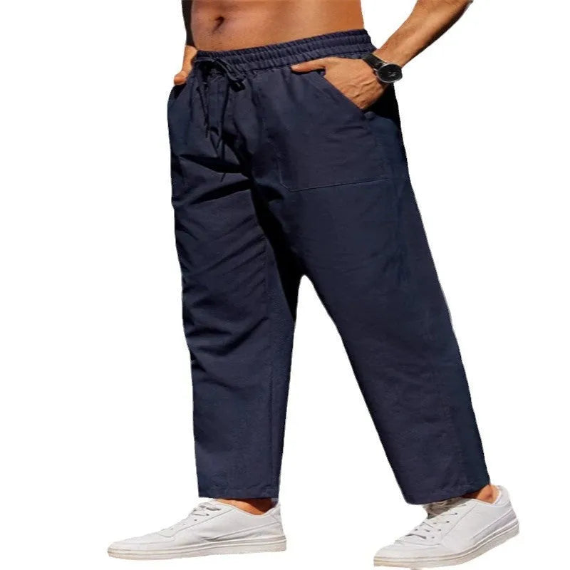 Men's straight-leg linen casual trousers with an elasticated waist in a solid colour.