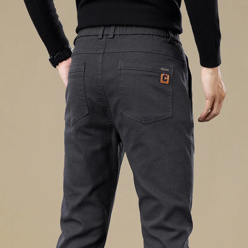 Men's fleece-lined slim fit tapered casual pants in black, cotton fabric, available in sizes 28-40