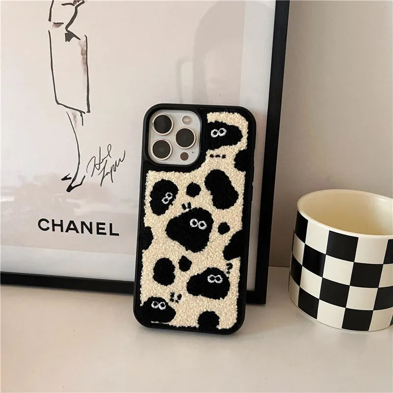 Black plush phone case with a Fairy design for iPhone models