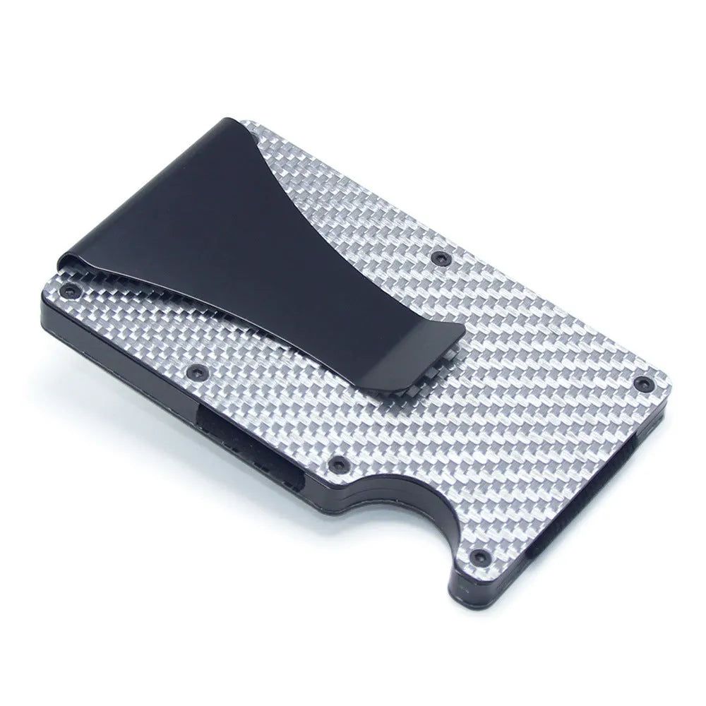 Slim black carbon fibre geometric wallet holding bank cards, showing 8mm thickness profile.