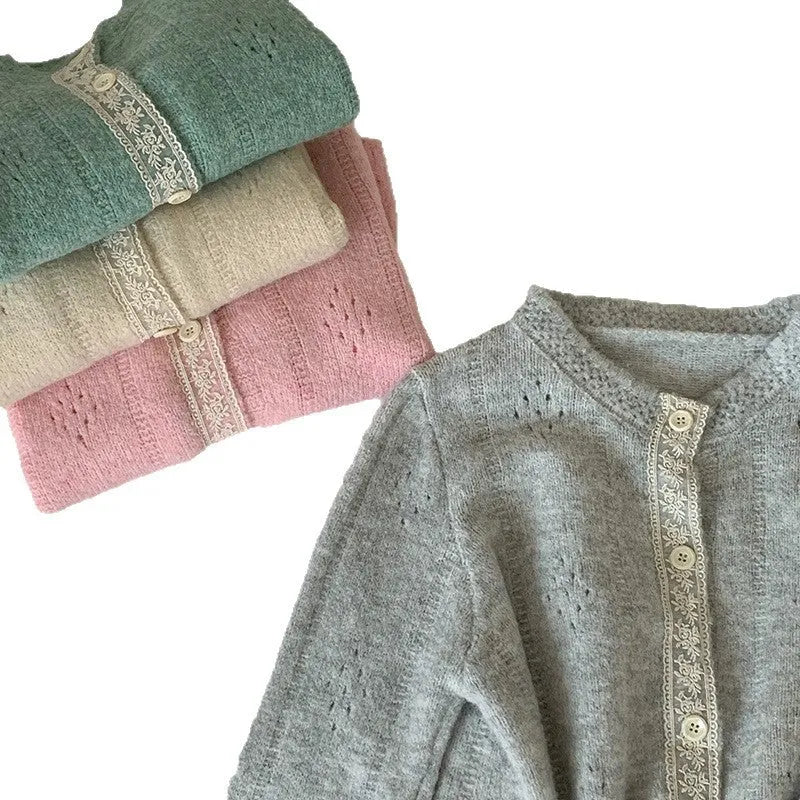 Retro style loose-fit viscose fibre cardigan in apricot colour, shown on a hanger.