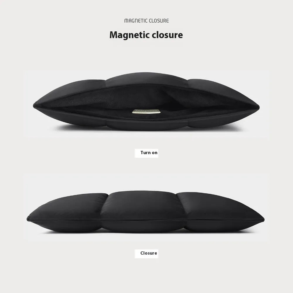 Soft black retro-style laptop sleeve for 13 to 15.6 inch laptops on a table.