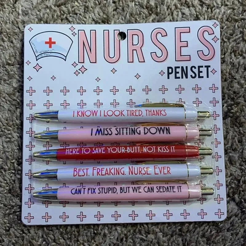 Five nurse-themed retractable ballpoint pens with humorous medical prints arranged together