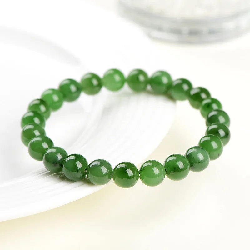 Polished natural jasper bead bracelet in Hetian jade, showing multiple bead size options on a wrist.
