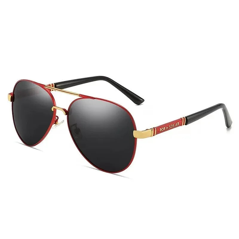 Gold metal frame polarised sunglasses with grey lenses on a table, showing dragon and phoenix temple detail.