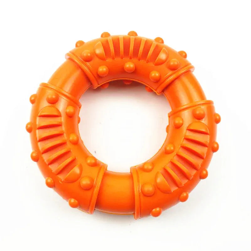 Blue hollow dog fetch stick toy lying on grass, showing its lightweight chewy construction.