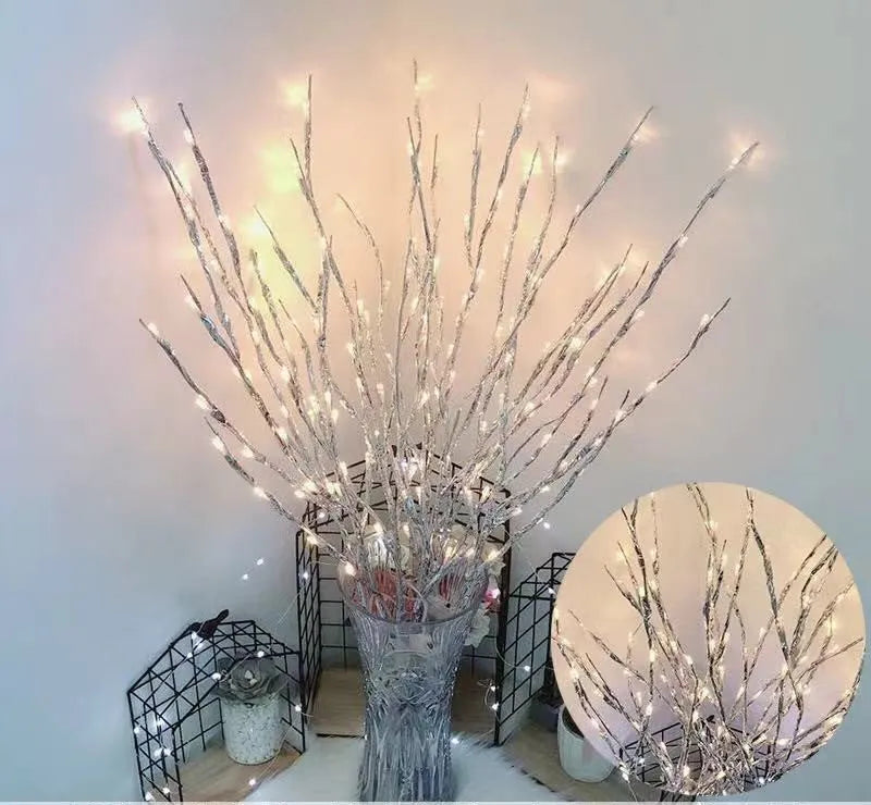 Silver branch LED decorative tree lamp with colour-changing lights in a vase base.