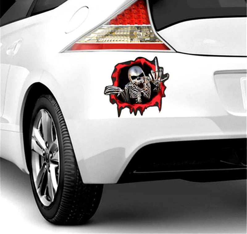 Colourful broken shell peeping metal skull design on a 15cm by 14cm car bumper sticker.