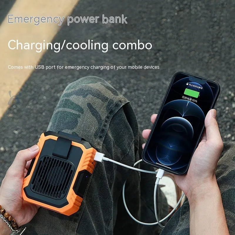 Green wrist hanging personal fan with light and USB charging port on a compact ABS and silicone body.