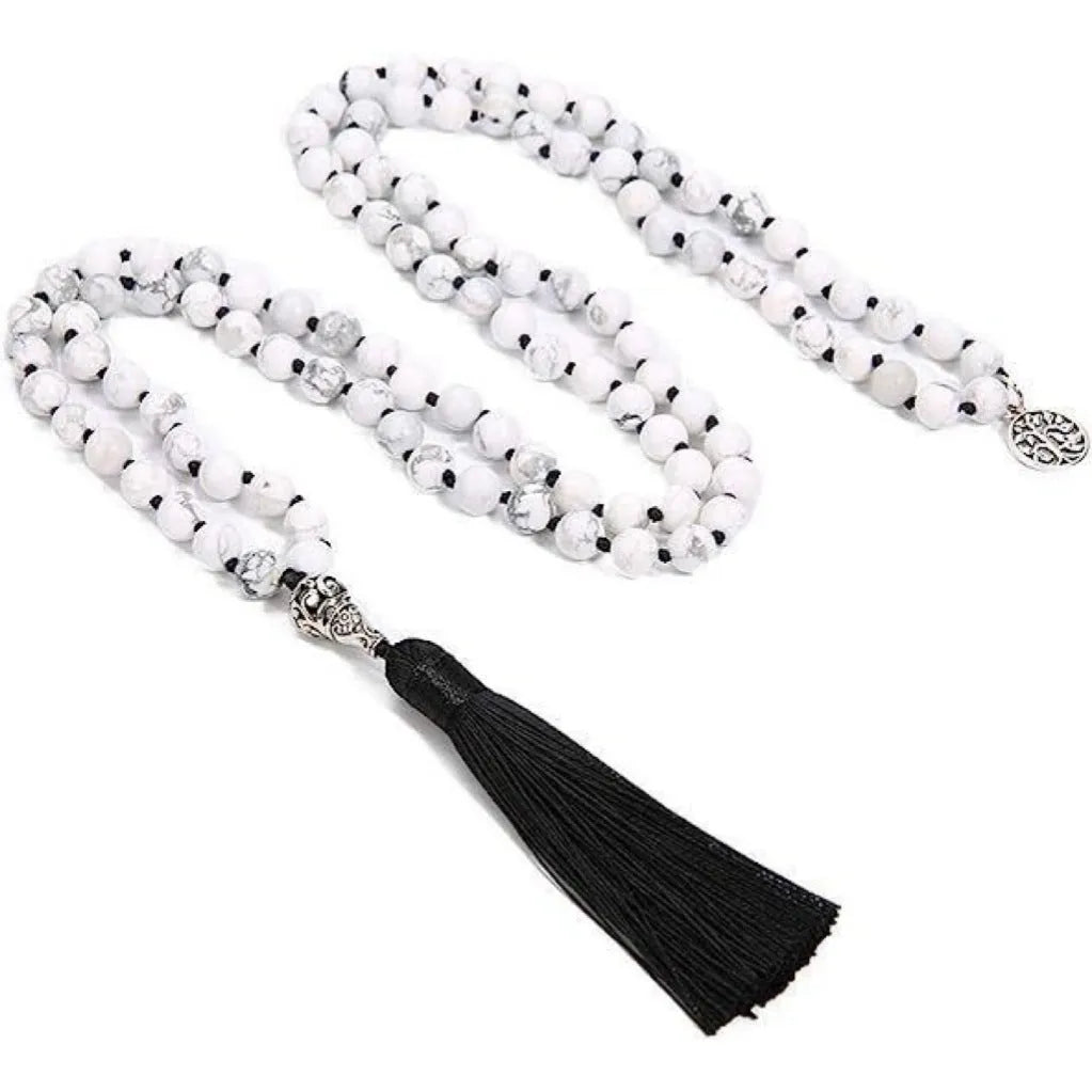 Handmade knotted stone bead necklace with 108 beads, showing geometric design and natural stone colours.