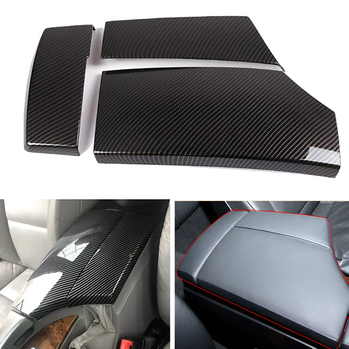 Three black ABS armrest box protective covers with a diagonal carbon fibre weave pattern.