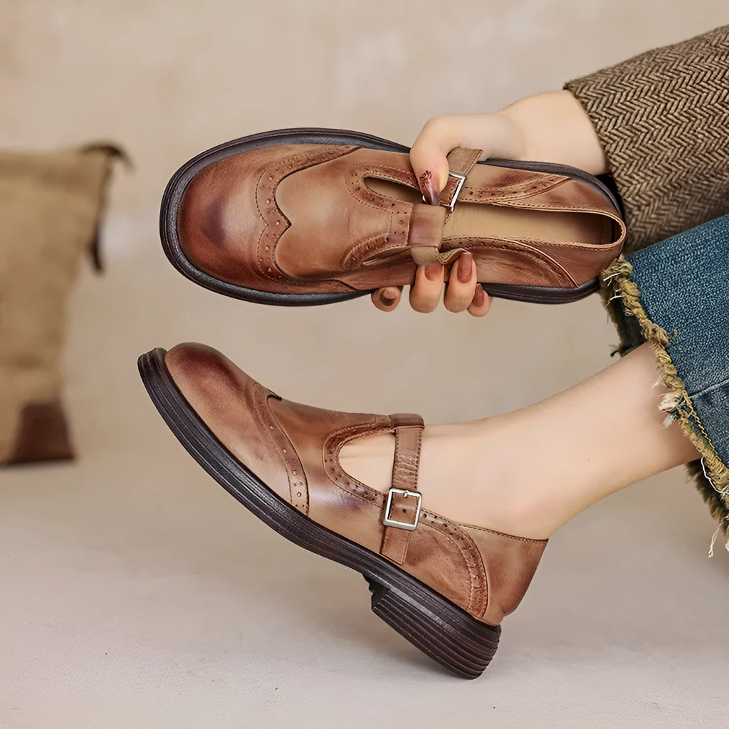 Women's brown sheepskin leather flat shoes with round toe design showing UK size label