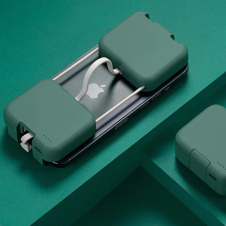 Multi-function bracket mobile power supply in red, green, or purple showing dual charging ports and integrated phone stand.