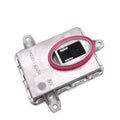 Metal automotive headlight ballast component showing its rectangular shape and electrical connectors.