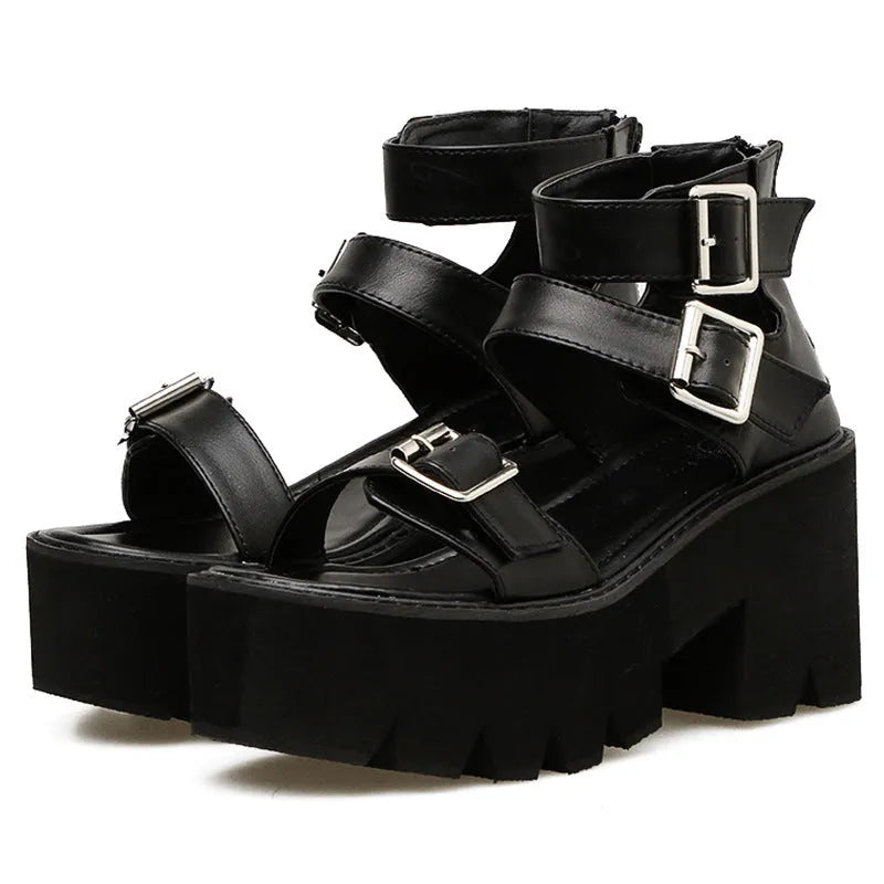 Black women's punk sandals with chunky thick heels, round toe, rear zipper, and a buckle detail.