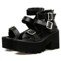 Black women's punk sandals with chunky thick heels, round toe, rear zipper, and a buckle detail.